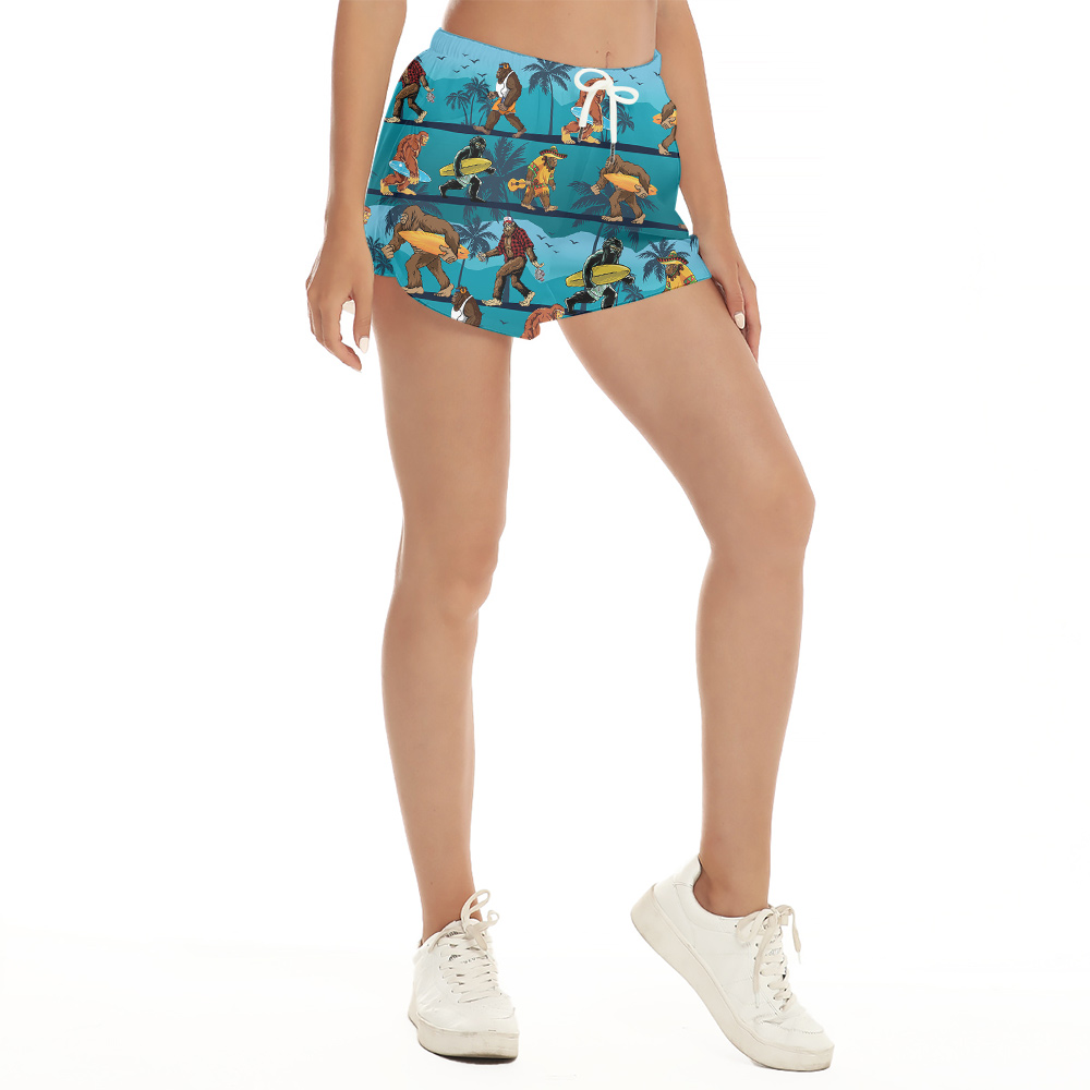 Funny Bigfoot Surfing Tropical Blue Women's Hawaiian Beach Shorts